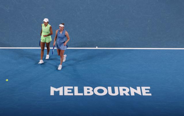 (260127) -- MELBOURNE, Jan. 27, 2026 (Xinhua) -- Zhang Shuai (L)/Elise Mertens react during the women's doubles 3rd round match between Zhang Shuai (China)/Elise Mertens (Belgium) and Hailey Baptiste/Peyton Stearns of the United States at the Australian Open tennis tournament in Melbourne, Australia, Jan. 27, 2026. (Xinhua/Ma Ping)