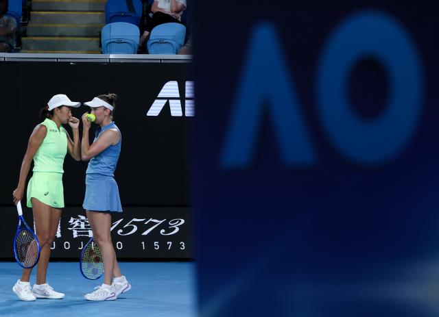 (260127) -- MELBOURNE, Jan. 27, 2026 (Xinhua) -- Zhang Shuai (L)/Elise Mertens are seen during the women's doubles 3rd round match between Zhang Shuai (China)/Elise Mertens (Belgium) and Hailey Baptiste/Peyton Stearns of the United States at the Australian Open tennis tournament in Melbourne, Australia, Jan. 27, 2026. (Xinhua/Ma Ping)