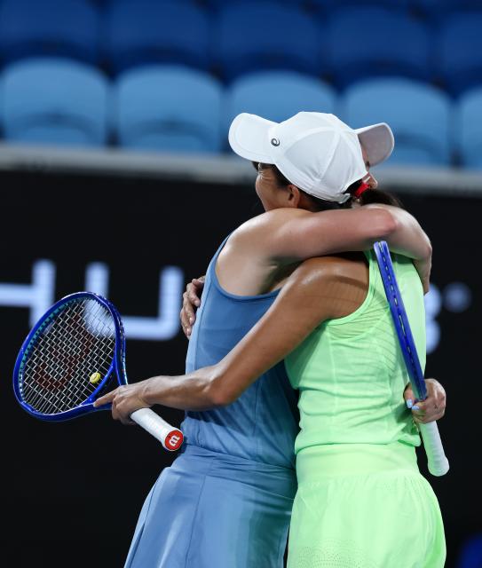 (260127) -- MELBOURNE, Jan. 27, 2026 (Xinhua) -- Zhang Shuai (R)/Elise Mertens react during the women's doubles 3rd round match between Zhang Shuai (China)/Elise Mertens (Belgium) and Hailey Baptiste/Peyton Stearns of the United States at the Australian Open tennis tournament in Melbourne, Australia, Jan. 27, 2026. (Xinhua/Ma Ping)