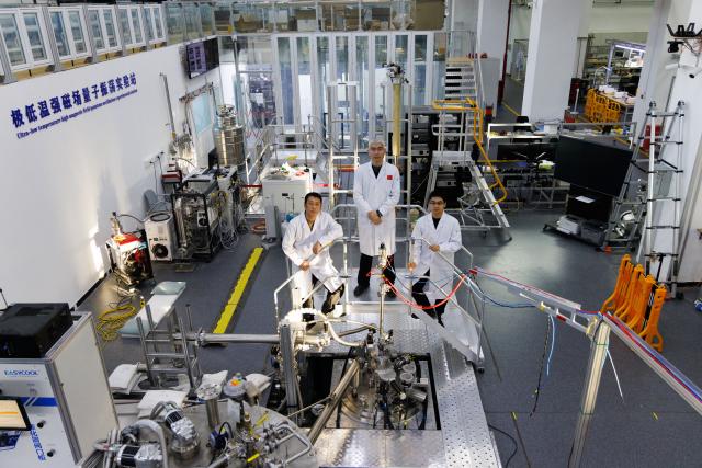 (260127) -- BEIJING, Jan. 27, 2026 (Xinhua) -- Researchers Li Gang, Liu Jianhua and Zhou Benzhe (L-R) pose for a group photo at the ultra-low temperature high magnetic field quantum oscillation experimental station of the Institute of Physics of the Chinese Academy of Sciences in Beijing, capital of China, on Jan. 26, 2026. China has achieved a 35.6 tesla all-superconducting magnet in an experiment facility, setting a new record, the Chinese Academy of Sciences (CAS) said on Tuesday.
   The all-superconducting magnet, with a central magnetic field of 35.6 tesla and a usable aperture of 35 millimeters was conducted with the Synergetic Extreme Condition User Facility. It is a user magnet designed to support domestic and international research teams in conducting cutting-edge studies.
   The record-breaking magnetic field is about 12 to 24 times that of a medical magnetic resonance imaging (MRI) system, the strongest magnetic field people can access in daily life, and over 700,000 times that of Earth's magnetic field.
   As one of the core facilities in modern technology, they hold significant application value in major national sci-tech infrastructures, advanced scientific instruments, high-end medical equipment, energy and transportation. (Xinhua/Jin Liwang)