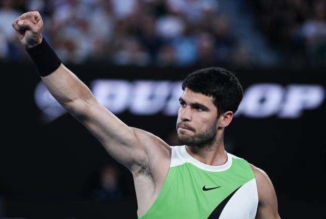 (260127) -- MELBOURNE, Jan. 27, 2026 (Xinhua) -- Carlos Alcaraz celebrates scoring during the men's singles quarterfinal match between Carlos Alcaraz of Spain and Alex de Minaur of Australia at the Australian Open tennis tournament in Melbourne, Australia, Jan. 27, 2026. (Photo by Wang Shen/Xinhua)