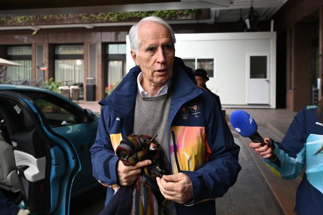 (260127) -- MILAN, Jan. 27, 2026 (Xinhua) -- Giovanni Malago (R), President of the Milano Cortina 2026 Organizing Committee, arrives at the hotel of the Olympic Family ahead of Milano Cortina 2026 Olympic Games in Milan, Italy, on Jan. 27, 2026. (Photo by Piero Cruciatti/Pool Photo via AFP)