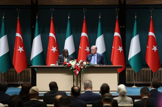 (260127) -- ANKARA, Jan. 27, 2026 (Xinhua) -- Turkish President Recep Tayyip Erdogan (R) and Nigerian President Bola Tinubu attend a joint press conference in Ankara, Türkiye, on Jan. 27, 2026. Türkiye and Nigeria have reaffirmed their commitment to reaching a 5-billion-U.S. dollar bilateral trade volume and agreed to deepen cooperation on security, energy and development, Turkish President Recep Tayyip Erdogan said here Tuesday. (Mustafa Kaya/Handout via Xinhua)