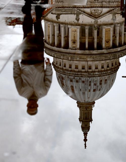 (260127) -- LONDON, Jan. 27, 2026 (Xinhua) -- A reflection of St Paul's Cathedral and a pedestrian walking past is seen in a puddle in London, Britain, Jan. 27, 2026, as Storm Chandra brings rain to much of the country. (Xinhua/Li Ying)
