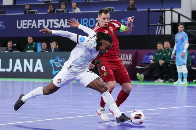 (260128) -- LJUBLJANA, Jan. 28, 2026 (Xinhua) -- Pany Varela (front) of Portugal shoots to score during the UEFA Futsal EURO 2026 group match between Hungary and Portugal at Arena Stozice, Ljubljana, Slovenia, Jan. 27, 2026. (Photo by Zeljko Stevanic/Xinhua)