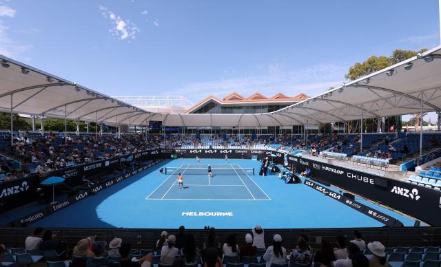 (260128) -- MELBOURNE, Jan. 28, 2026 (Xinhua) -- This photo taken on Jan. 28, 2026 shows the women's doubles quarterfinal match between Zhang Shuai (China)/Elise Mertens (Belgium) and Wu Fang-Hsien (Chinese Taipei)/Hozumi Eri (Japan) at the Australian Open tennis tournament in Melbourne, Australia. (Xinhua/Ma Ping)