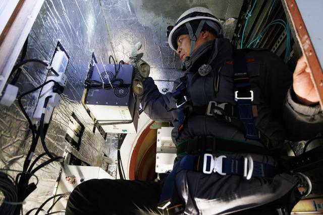 (260128) -- MOHE, Jan. 28, 2026 (Xinhua) -- Shi Shengpu, director of the Mohe Station of the China Remote Sensing Satellite Ground Station, performs maintenance tasks inside the central structure of the antenna at the station in Mohe, northeast China's Heilongjiang Province, on Jan. 25, 2026.
  The Mohe Station of the China Remote Sensing Satellite Ground Station is China's northernmost satellite data receiving station. Normally the facility has only one staff member on duty, but as the Spring Festival approaches, four of its staff members have gathered in severe cold weather to conduct thorough winter inspections and maintenance.
  Developed by the Aerospace Information Research Institute under the Chinese Academy of Sciences, the Mohe Station commenced operations on Dec. 12, 2025.
  Located in Mohe, China's northernmost city in Heilongjiang Province, the station is designed to autonomously receive satellite data. It is now tasked with receiving data from 25 national land observation satellites, the institute said.
  The Mohe station boasts a maximum channel downlink data rate of 2 gigabits per second and can transmit the received data in real time. Leveraging its high-latitude geographical advantage, the station can extend the daily receiving time window for polar-orbiting satellites by over 20 percent. (Xinhua/Jin Liwang)