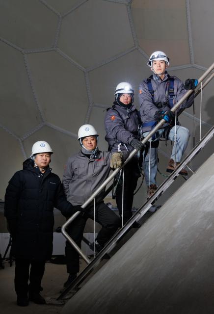 (260128) -- MOHE, Jan. 28, 2026 (Xinhua) -- Shi Shengpu, director of the Mohe Station of China Remote Sensing Satellite Ground Station (2nd L), Engineer Gao Jingfei (1st L), Engineer Li Qiang (3rd L) and Assistant Engineer Tian Dong pose for a photo inside the antenna radome at the Mohe Station of the China Remote Sensing Satellite Ground Station in Mohe, northeast China's Heilongjiang Province, on Jan. 24, 2026.
  The Mohe Station of the China Remote Sensing Satellite Ground Station is China's northernmost satellite data receiving station. Normally the facility has only one staff member on duty, but as the Spring Festival approaches, four of its staff members have gathered in severe cold weather to conduct thorough winter inspections and maintenance.
  Developed by the Aerospace Information Research Institute under the Chinese Academy of Sciences, the Mohe Station commenced operations on Dec. 12, 2025.
  Located in Mohe, China's northernmost city in Heilongjiang Province, the station is designed to autonomously receive satellite data. It is now tasked with receiving data from 25 national land observation satellites, the institute said.
  The Mohe station boasts a maximum channel downlink data rate of 2 gigabits per second and can transmit the received data in real time. Leveraging its high-latitude geographical advantage, the station can extend the daily receiving time window for polar-orbiting satellites by over 20 percent. (Xinhua/Jin Liwang)