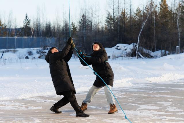 (260128) -- MOHE, Jan. 28, 2026 (Xinhua) -- Engineer Gao Jingfei (L) and Assistant Engineer Tian Dong clear snow on top of the antenna radome at the Mohe Station of the China Remote Sensing Satellite Ground Station in Mohe, northeast China's Heilongjiang Province, on Jan. 25, 2026.
  The Mohe Station of the China Remote Sensing Satellite Ground Station is China's northernmost satellite data receiving station. Normally the facility has only one staff member on duty, but as the Spring Festival approaches, four of its staff members have gathered in severe cold weather to conduct thorough winter inspections and maintenance.
  Developed by the Aerospace Information Research Institute under the Chinese Academy of Sciences, the Mohe Station commenced operations on Dec. 12, 2025.
  Located in Mohe, China's northernmost city in Heilongjiang Province, the station is designed to autonomously receive satellite data. It is now tasked with receiving data from 25 national land observation satellites, the institute said.
  The Mohe station boasts a maximum channel downlink data rate of 2 gigabits per second and can transmit the received data in real time. Leveraging its high-latitude geographical advantage, the station can extend the daily receiving time window for polar-orbiting satellites by over 20 percent. (Xinhua/Jin Liwang)