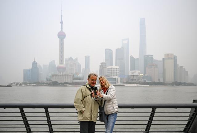 (260128) -- BEIJING, Jan. 28, 2026 (Xinhua) -- Austrian tourist Christian Edlinger (L) and his wife Heidi Reiss-Edlinger pose for a photo at the Bund in Shanghai, east China, Jan. 6, 2026. It was their fourth visit to China.
  Fueled by China's expanding visa-free policies, inbound travel surged in 2025, with visa-free entries jumping 49.5 percent year-on-year to nearly 30.1 million, official data showed.
  The National Immigration Administration said on Wednesday that international visitors made over 82 million crossings in total, marking a 26.4 percent year-on-year increase.
  Currently, China offers visa-free entry to citizens of 76 countries. Plus, travelers from 55 countries can take advantage of a 240-hour visa-free transit policy at 65 different entry points. 
  Beyond short-term visits, this openness is fostering a vibrant community of international residents. More scholars, students, and professionals are choosing to live and work in China, deepening people-to-people bonds. China, with much to be explored and a lot more to offer, continues to captivate hearts and minds worldwide. (Xinhua/Chen Haoming)