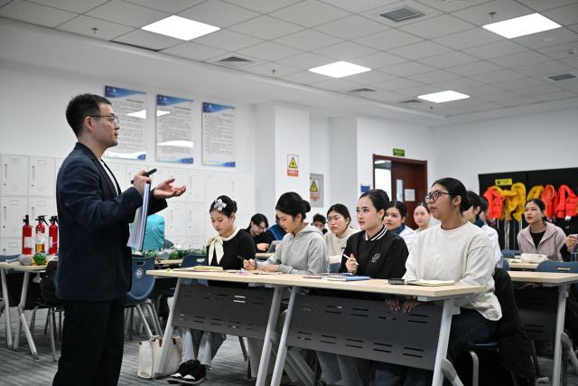 (260128) -- BEIJING, Jan. 28, 2026 (Xinhua) -- Thai students from Suan Dusit University learn cabin safety management during an exchange activity at the Civil Aviation University of China in Tianjin, north China, Jan. 8, 2026.
  Fueled by China's expanding visa-free policies, inbound travel surged in 2025, with visa-free entries jumping 49.5 percent year-on-year to nearly 30.1 million, official data showed.
  The National Immigration Administration said on Wednesday that international visitors made over 82 million crossings in total, marking a 26.4 percent year-on-year increase.
  Currently, China offers visa-free entry to citizens of 76 countries. Plus, travelers from 55 countries can take advantage of a 240-hour visa-free transit policy at 65 different entry points. 
  Beyond short-term visits, this openness is fostering a vibrant community of international residents. More scholars, students, and professionals are choosing to live and work in China, deepening people-to-people bonds. China, with much to be explored and a lot more to offer, continues to captivate hearts and minds worldwide. (Xinhua/Sun Fanyue)