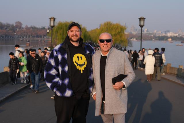 (260128) -- BEIJING, Jan. 28, 2026 (Xinhua) -- Spanish tourist Jose Vicente Guerrero (R, front) and his son Ander Guerrero pose for a photo at West Lake scenic area in Hangzhou, east China's Zhejiang Province, Jan. 3, 2026.
  Fueled by China's expanding visa-free policies, inbound travel surged in 2025, with visa-free entries jumping 49.5 percent year-on-year to nearly 30.1 million, official data showed.
  The National Immigration Administration said on Wednesday that international visitors made over 82 million crossings in total, marking a 26.4 percent year-on-year increase.
  Currently, China offers visa-free entry to citizens of 76 countries. Plus, travelers from 55 countries can take advantage of a 240-hour visa-free transit policy at 65 different entry points. 
  Beyond short-term visits, this openness is fostering a vibrant community of international residents. More scholars, students, and professionals are choosing to live and work in China, deepening people-to-people bonds. China, with much to be explored and a lot more to offer, continues to captivate hearts and minds worldwide. (Xinhua/Huang Zongzhi)