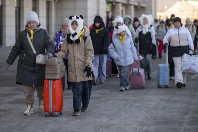 (260128) -- BEIJING, Jan. 28, 2026 (Xinhua) -- Foreign tourists walk out of Suifenhe Railway Station in Suifenhe, northeast China's Heilongjiang Province, on Jan. 8, 2026.
  Fueled by China's expanding visa-free policies, inbound travel surged in 2025, with visa-free entries jumping 49.5 percent year-on-year to nearly 30.1 million, official data showed.
  The National Immigration Administration said on Wednesday that international visitors made over 82 million crossings in total, marking a 26.4 percent year-on-year increase.
  Currently, China offers visa-free entry to citizens of 76 countries. Plus, travelers from 55 countries can take advantage of a 240-hour visa-free transit policy at 65 different entry points. 
  Beyond short-term visits, this openness is fostering a vibrant community of international residents. More scholars, students, and professionals are choosing to live and work in China, deepening people-to-people bonds. China, with much to be explored and a lot more to offer, continues to captivate hearts and minds worldwide. (Xinhua/Zhang Tao)