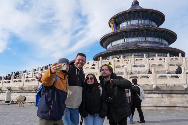 (260128) -- BEIJING, Jan. 28, 2026 (Xinhua) -- Mexican tourists and their tour guide (1st L) pose for photos at the Tiantan (Temple of Heaven) Park in Beijing, capital of China, Jan. 7, 2026.
  Fueled by China's expanding visa-free policies, inbound travel surged in 2025, with visa-free entries jumping 49.5 percent year-on-year to nearly 30.1 million, official data showed.
  The National Immigration Administration said on Wednesday that international visitors made over 82 million crossings in total, marking a 26.4 percent year-on-year increase.
  Currently, China offers visa-free entry to citizens of 76 countries. Plus, travelers from 55 countries can take advantage of a 240-hour visa-free transit policy at 65 different entry points. 
  Beyond short-term visits, this openness is fostering a vibrant community of international residents. More scholars, students, and professionals are choosing to live and work in China, deepening people-to-people bonds. China, with much to be explored and a lot more to offer, continues to captivate hearts and minds worldwide. (Xinhua/Ju Huanzong)
