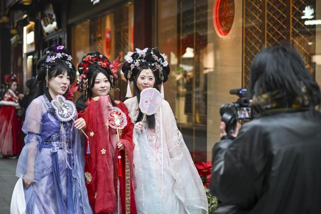 (260128) -- BEIJING, Jan. 28, 2026 (Xinhua) -- South Korean tourists dressed in Hanfu, a traditional Chinese attire, pose for photos in Yuyuan Garden in Shanghai, east China, Jan. 6, 2026.
  Fueled by China's expanding visa-free policies, inbound travel surged in 2025, with visa-free entries jumping 49.5 percent year-on-year to nearly 30.1 million, official data showed.
  The National Immigration Administration said on Wednesday that international visitors made over 82 million crossings in total, marking a 26.4 percent year-on-year increase.
  Currently, China offers visa-free entry to citizens of 76 countries. Plus, travelers from 55 countries can take advantage of a 240-hour visa-free transit policy at 65 different entry points. 
  Beyond short-term visits, this openness is fostering a vibrant community of international residents. More scholars, students, and professionals are choosing to live and work in China, deepening people-to-people bonds. China, with much to be explored and a lot more to offer, continues to captivate hearts and minds worldwide. (Xinhua/Chen Haoming)