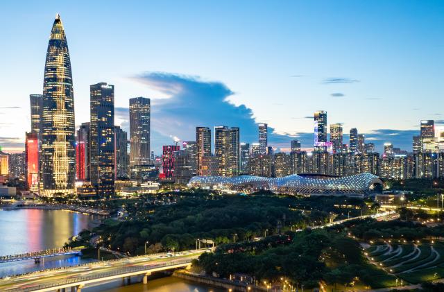 (260128) -- BEIJING, Jan. 28, 2026 (Xinhua) -- An aerial drone photo taken on June 25, 2025 shows a view of Shenzhen Bay Sports Center and surrounding buildings in Shenzhen, south China's Guangdong Province. (Xinhua/Mao Siqian)