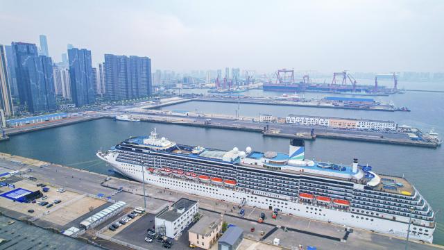 (260128) -- BEIJING, Jan. 28, 2026 (Xinhua) -- An aerial drone photo taken on May 27, 2025 shows cruise ship Adora Mediterranea docking at a port in Dalian, northeast China's Liaoning Province. (Xinhua/Pan Yulong)
