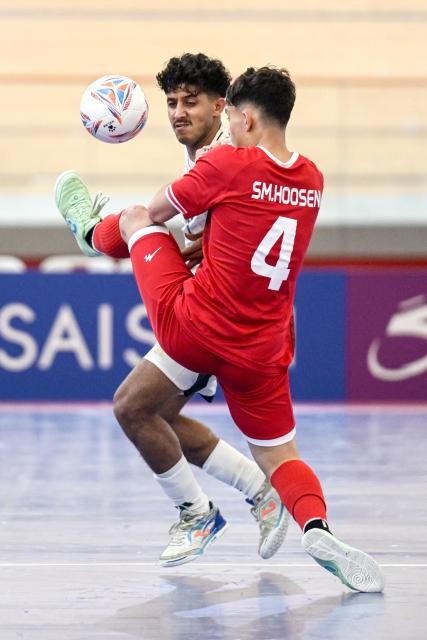 (260128) -- JAKARTA, Jan. 28, 2026 (Xinhua) -- Sayed Mortaza Hussaini (R) of Afghanistan competes during the group D match  between Afghanistan and Saudi Arabia at the AFC Futsal Asian Cup 2026 in Jakarta, Indonesia, Jan. 28, 2026. (Xinhua/Agung Kuncahya B.)
