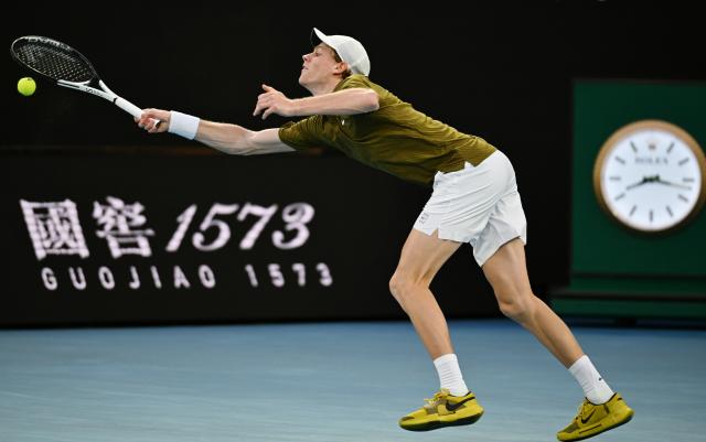 (260128) -- MELBOURNE, Jan. 28, 2026 (Xinhua) -- Jannik Sinner hits a return during the men's singles quarterfinal match between Ben Shelton of the United States and Jannik Sinner of Italy at the Australian Open tennis tournament in Melbourne, Australia, Jan. 28, 2026. (Photo by Wang Shen/Xinhua)