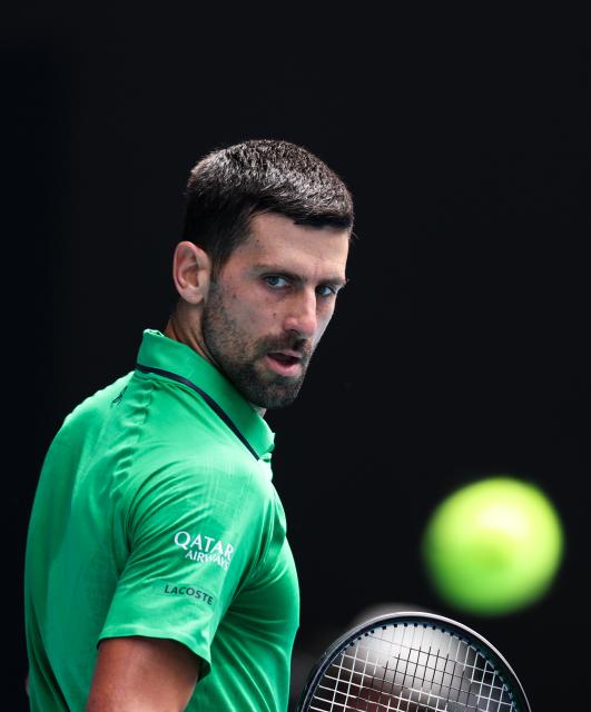 (260128) -- MELBOURNE, Jan. 28, 2026 (Xinhua) -- Novak Djokovic of Serbia reacts during the men's singles quarterfinal match between Novak Djokovic of Serbia and Lorenzo Musetti of Italy at the Australian Open tennis tournament in Melbourne, Australia, Jan. 28, 2026. (Xinhua/Ma Ping)