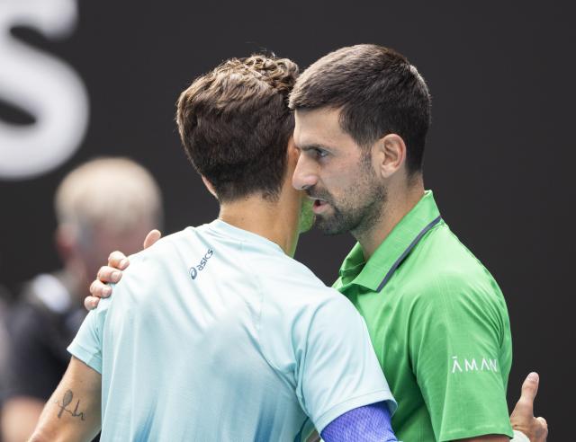 (260128) -- MELBOURNE, Jan. 28, 2026 (Xinhua) -- Novak Djokovic (R) of Serbia greets with Lorenzo Musetti of Italy during the men's singles quarterfinal match between Novak Djokovic of Serbia and Lorenzo Musetti of Italy at the Australian Open tennis tournament in Melbourne, Australia, Jan. 28, 2026. (Photo by Hu Jingchen/Xinhua)