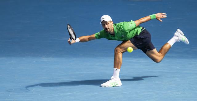 (260128) -- MELBOURNE, Jan. 28, 2026 (Xinhua) -- Novak Djokovic of Serbia hits a return during the men's singles quarterfinal match between Novak Djokovic of Serbia and Lorenzo Musetti of Italy at the Australian Open tennis tournament in Melbourne, Australia, Jan. 28, 2026. (Photo by Hu Jingchen/Xinhua)