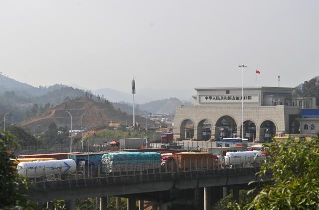 (260128) -- PINGXIANG, Jan. 28, 2026 (Xinhua) -- Vehicles wait to pass through Youyiguan Port, or Friendship Pass, in Pingxiang City, south China's Guangxi Zhuang Autonomous Region, Jan. 28, 2026. Youyiguan Port, China's main gateway to Vietnam, upgraded its border clearance system in January, significantly reducing customs clearance time and providing convenience for vehicles entering and exiting. (Xinhua/Lu Boan)