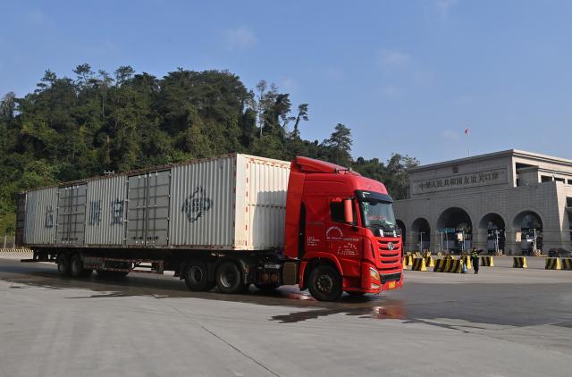 (260128) -- PINGXIANG, Jan. 28, 2026 (Xinhua) -- A truck enters Youyiguan Port, or Friendship Pass, in Pingxiang City, south China's Guangxi Zhuang Autonomous Region, Jan. 28, 2026. Youyiguan Port, China's main gateway to Vietnam, upgraded its border clearance system in January, significantly reducing customs clearance time and providing convenience for vehicles entering and exiting. (Xinhua/Lu Boan)