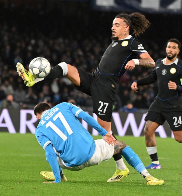 (260129) -- NAPLES, Jan. 29, 2026 (Xinhua) -- Napoli's Mathias Olivera (bottom) vies with Chelsea's Malo Gusto during the UEFA Champions League football match between Napoli and Chelsea in Naples, Italy, Jan. 28, 2025. (Photo by Alberto Lingria/Xinhua)