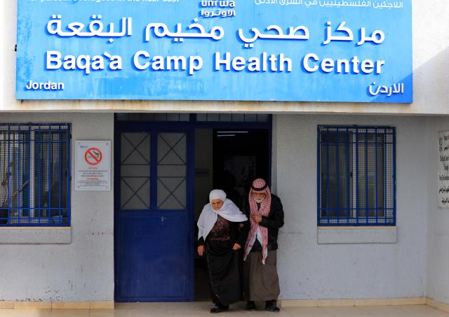 (260129) -- AMMAN, Jan. 29, 2026 (Xinhua) -- An elderly couple step out of a health center in Baqa'a refugee camp in Jordan, on Jan. 28, 2026.
  Baqa'a camp is the largest Palestinian refugee camp in Jordan. Lying about 20 kilometers north of Amman, it was set up in 1968, when residents were initially accommodated in temporary tents. Today, most of the camp's inhabitants have built more durable concrete shelters. (Photo by Mohammad Abu Ghosh/Xinhua)