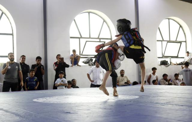 (260129) -- SANAA, Jan. 29, 2026 (Xinhua) -- Yemeni junior competitors fight during a Wushu and Kung Fu competition in Sanaa, Yemen, on Jan. 28, 2026. (Photo by Mohammed Mohammed/Xinhua)