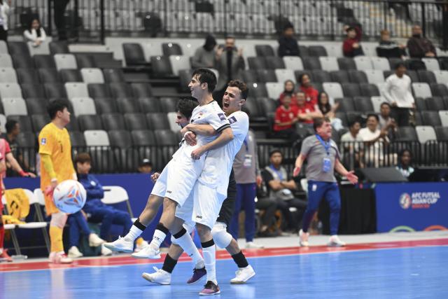 (260129) -- JAKARTA, Jan. 29, 2026 (Xinhua) -- Salim Kadhim Al-Darraji (L) of Iraq celebrates his goal during the group A match between South Korea and Iraq at the AFC Futsal Asian Cup 2026 in Jakarta, Indonesia, Jan. 29, 2026. (Xinhua/Zulkarnain)