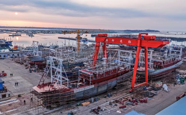 (260129) -- BEIJING, Jan. 29, 2026 (Xinhua) -- A drone photo taken on Jan. 28, 2026 shows a vessel under maintenance at an offshore engineering equipment industrial base in Rongcheng City of east China's Shandong Province. Enterprises across the country are going full steam ahead in production at the end of January, striving for a strong start in the first month of a new year. (Photo by Li Xinjun/Xinhua)