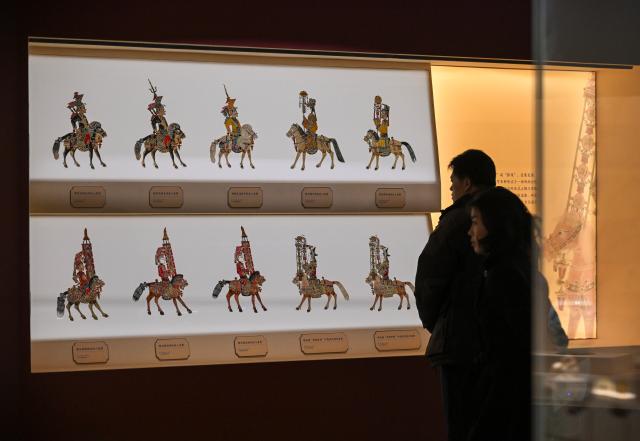 (260129) -- BEIJING, Jan. 29, 2026 (Xinhua) -- People view exhibits at an exhibition themed on Chinese zodiac Year of the Horse at the National Museum of China in Beijing, capital of China, Jan. 29, 2026. The exhibition, displaying over 120 pieces (sets) of cultural relics, will open here on Jan. 30. (Xinhua/Jin Liangkuai)