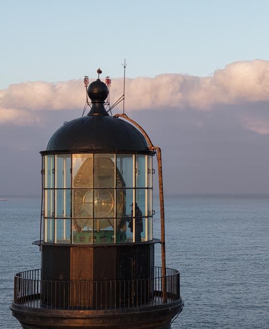 (260129) -- ZHOUSHAN, Jan. 29, 2026 (Xinhua) -- An aerial drone photo taken on Jan. 28, 2026 shows a lighthouse keeper maintaining the Huaniao lighthouse in Huaniao Town of Shengsi County in Zhoushan City, east China's Zhejiang Province. The Huaniao lighthouse, built in 1870, is located at the northernmost point of the Zhoushan archipelago on the shipping route from the Yangtze River estuary to the Pacific Ocean. (Xinhua/Huang Zongzhi)