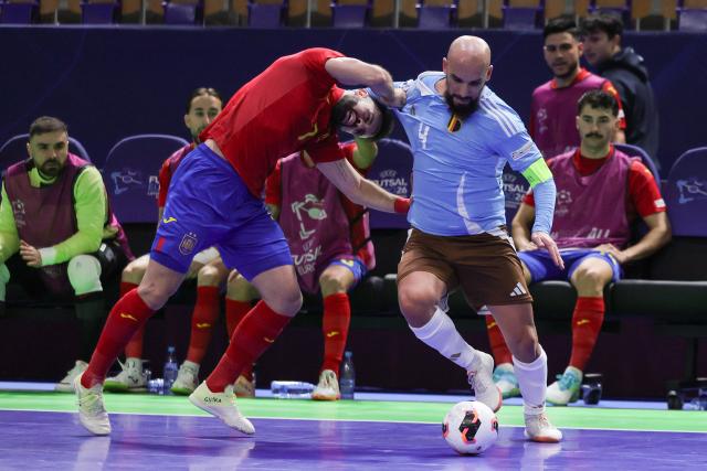 (260130) -- LJUBLJANA, Jan. 30, 2026 (Xinhua) -- Jose Raya (L) of Spain vies with Omar Rahou (R) of Belgium during the UEFA Futsal EURO 2026 group match between Spain and Belgium at Arena Stozice, Ljubljana, Slovenia, Jan. 29, 2026. (Photo by Zeljko Stevanic/Xinhua)