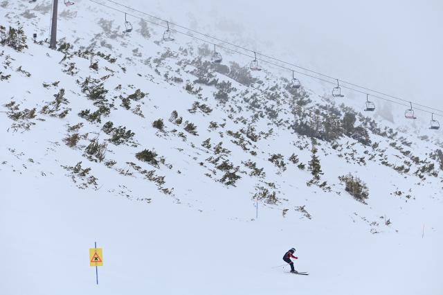 (260130) -- ZAKOPANE, Jan. 30, 2026 (Xinhua) -- A skier is seen on a snowy slope in the Tatra National Park near Zakopane, Poland, Jan. 29, 2026. Located in the Tatra Mountains in southern Poland, the park is known for its unique alpine landscapes and is a popular winter destination for skiing and snow sports. (Photo by Aleksy Witwicki/Xinhua)