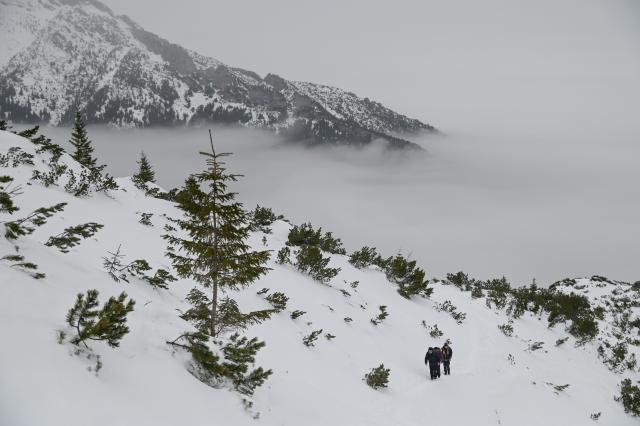 (260130) -- ZAKOPANE, Jan. 30, 2026 (Xinhua) -- People hike in the Tatra National Park near Zakopane, Poland, Jan. 29, 2026. Located in the Tatra Mountains in southern Poland, the park is known for its unique alpine landscapes and is a popular winter destination for skiing and snow sports. (Photo by Aleksy Witwicki/Xinhua)