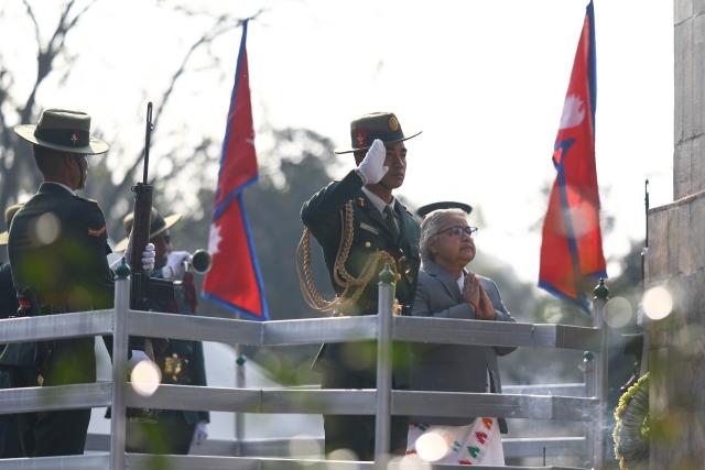 (260130) -- KATHMANDU, Jan. 30, 2026 (Xinhua) -- Nepalese Prime Minister Sushila Karki (1st, R) pays homage to martyrs on the occasion of Martyrs' Day at Martyrs Memorial Park in Kathmandu, Nepal, Jan. 30, 2026. (Photo by Sulav Shrestha/Xinhua)