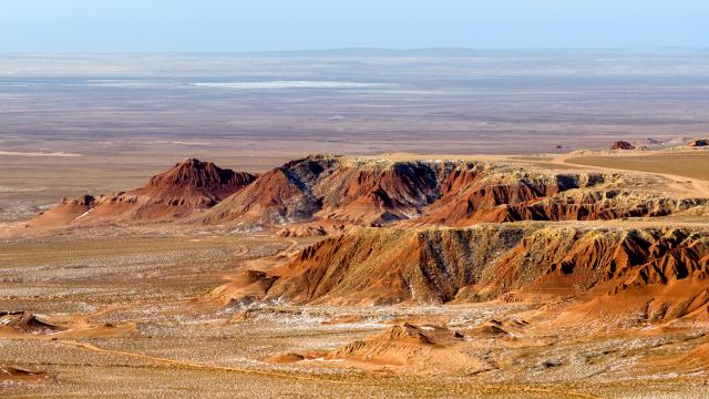 (260130) -- ULANQAB, Jan. 30, 2026 (Xinhua) -- An aerial drone photo taken on Jan. 29, 2026 shows a scene of the Hongya Tableland in Siziwang Banner, north China's Inner Mongolia Autonomous Region. Located in the northern part of Siziwang Banner in Ulanqab, the Hongya Tableland is a key component of the Siziwang National Geopark in north China's Inner Mongolia Autonomous Region. Featuring towering red hills and deep gullies, the landscape forms a majestic painting with lingering snow. (Xinhua/Ma Jinrui)