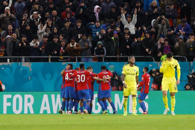 (260130) -- BUCHAREST, Jan. 30, 2026 (Xinhua) -- FCSB's players celebrate scoring during the UEFA Europa League football match between Fenerbahce and FCSB at Arena Nationala stadium in Bucharest, Romania, Jan. 29, 2026. (Photo by Cristian Cristel/Xinhua)