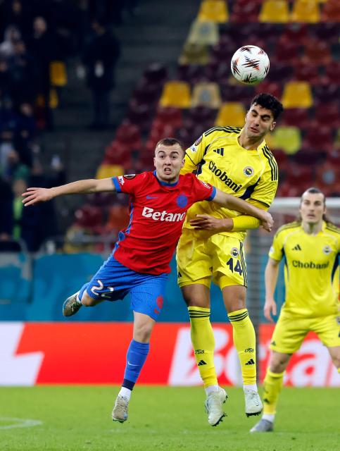(260130) -- BUCHAREST, Jan. 30, 2026 (Xinhua) -- FCSB's Mihai Toma (L) vies with Fenerbahce's Yigit Efe Demir during the UEFA Europa League football match between Fenerbahce and FCSB at Arena Nationala stadium in Bucharest, Romania, Jan. 29, 2026. (Photo by Cristian Cristel/Xinhua)
