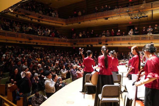 (260130) -- PHILADELPHIA, Jan. 30, 2026 (Xinhua) -- Musicians from the Central Conservatory of Music Chinese Orchestra interact with audience during a special Chinese New Year concert at the Kimmel Center's Perelman Theater in Philadelphia, Pennsylvania, the United States, on Jan. 29, 2026. (Xinhua/Zhang Fengguo)