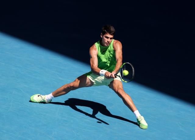 (260130) -- MELBOURNE, Jan. 30, 2026 (Xinhua) -- Carlos Alcaraz hits a return during the men's singles semifinal match between Carlos Alcaraz of Spain and Alexander Zverev of Germany at the Australian Open tennis tournament in Melbourne, Australia, Jan. 30, 2026. (Xinhua/Ma Ping)