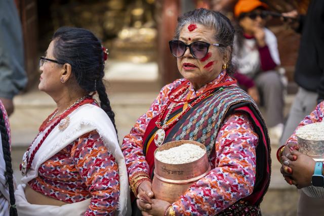 (260130) -- LALITPUR, Jan. 30, 2026 (Xinhua) -- People from Newari community in traditional attire take part in a parade with offerings to celebrate the Bhimsen Puja festival in Lalitpur, Nepal, Jan. 30, 2026. (Photo by Hari Maharjan/Xinhua)