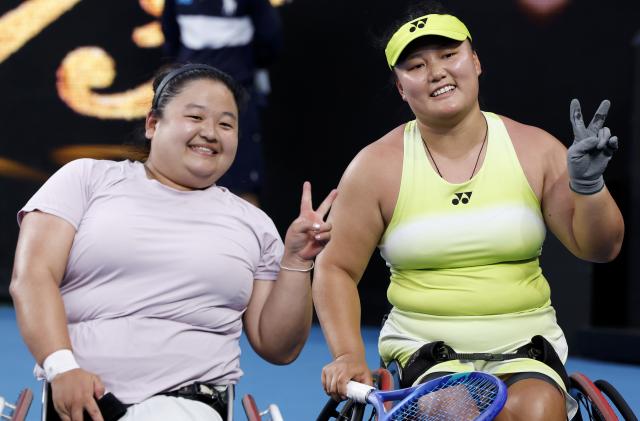 (260130) -- MELBOURNE, Jan. 30, 2026 (Xinhua) -- Wang Ziying (L)/Li Xiaohui react after the women's wheelchair doubles final between Wang Ziying/Li Xiaohui (China) and Zhu Zhenzhen (China)/Kamiji Yui (Japan) at the Australian Open tennis tournament in Melbourne, Australia, Jan. 30, 2026. (Xinhua/Ma Ping)