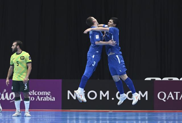 (260130) -- JAKARTA, Jan. 30, 2026 (Xinhua) -- Ropiev Ikhtiyor (R) of Uzbekistan celebrates a goal with his teammate during the group C match between Australia and Uzbekistan at the AFC Futsal Asian Cup 2026 in Jakarta, Indonesia, Jan. 30, 2026. (Xinhua/Zulkarnain)