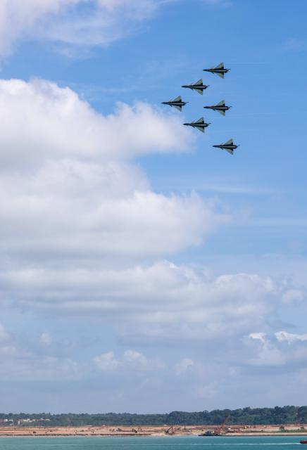 (260130) -- SINGAPORE, Jan. 30, 2026 (Xinhua) -- Aircraft of the Bayi Aerobatic Team of the Chinese People's Liberation Army (PLA) Air Force conduct training exercises for the 10th Singapore Airshow over the sea near Singapore's Changi Airport in Singapore, Jan. 30, 2026. (Photo by Zhu Jianghai/Xinhua)