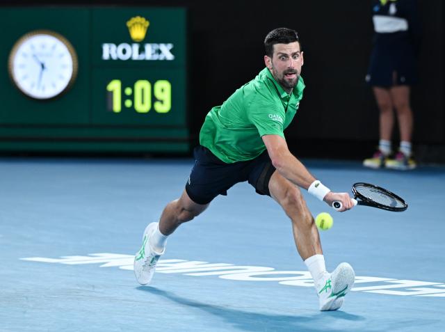 (260130) -- MELBOURNE, Jan. 30, 2026 (Xinhua) -- Novak Djokovic hits a return during the men's singles semifinal match between Novak Djokovic of Serbia and Jannik Sinner of Italy at the Australian Open tennis tournament in Melbourne, Australia, Jan. 30, 2026. (Photo by Wang Shen/Xinhua)