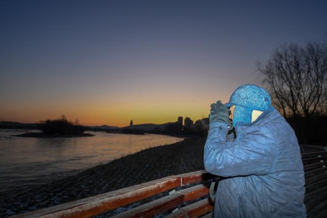 (260130) -- JILIN, Jan. 30, 2026 (Xinhua) -- Ren Jianguo observes bird habitats on Changbai Island in Jilin City, northeast China's Jilin Province, Dec. 6, 2019. Wang Tingting, a post-90s bird protector, stays every day at Changbai Island wetland park, a bird paradise seated by the Songhua River in Jilin City, to care for the birds--providing food and observing their living conditions.
   In 1996, Wang Tingting's uncle Ren Jianguo dropped his business as a ferryman near Changbai Island, and became a bird keeper as he often saw people hunting birds.
   Wang took over her uncle's job when he was hospitalized for a sudden illness in 2023, and has rescued more than 50 birds on average each year.
   In recent years, local authorities of the city have continuously restored the wetland ecology of Changbai Island. Through a series of effective measures such as dispatching dedicated personnel for bird protection, standardizing viewing activities, strictly controlling sewage discharge, and scientifically restocking, Changbai Island has returned to its natural ecological beauty.
   Nowadays, over 13,000 birds come to Changbai Island for the winter every year. The spectacle of thousands of birds flocking together has become a major attraction for both citizens and tourists. (Xinhua/Zhang Nan)